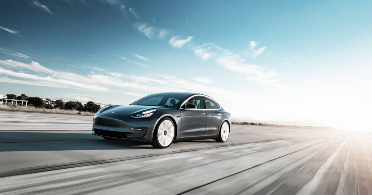 Tesla speeding down the highway